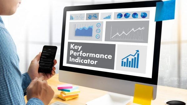 KPI acronym (Key Performance Indicator) Plan businessman hand working
