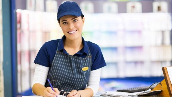 Female paint store clerk working