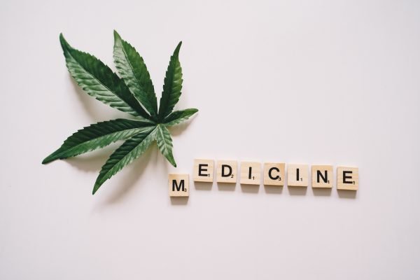 cannabis leaf next to the word medicine